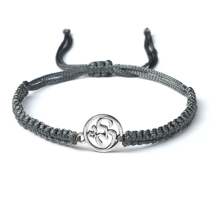 Bracelet porte-bonheur japonais en corde tressée gris argent